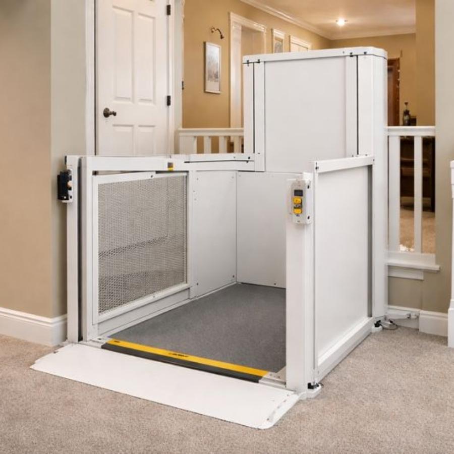 Indoor vertical platform lift for wheelchairs installed in a North Charleston, SC home to provide safe multi-level accessibility