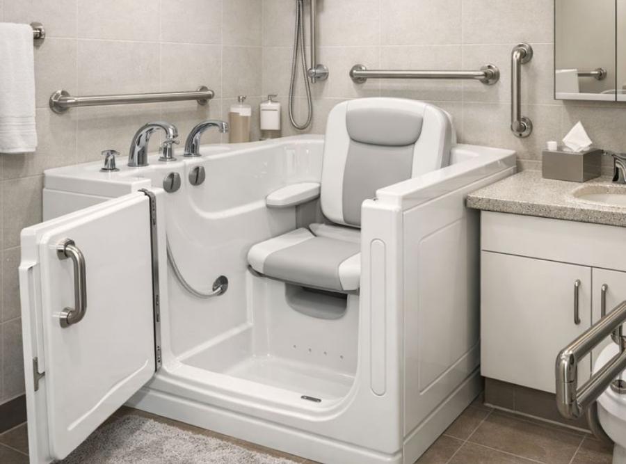 
Luxurious white walk-in soaking tub with an outward-opening door, integrated swivel seat with armrests, and stainless steel safety grab bars installed in a Ridgeland, GA bathroom.