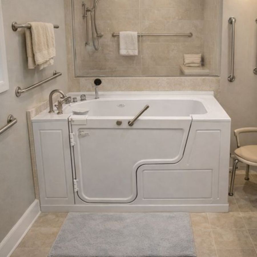 Savannah GA walk-in tub in a fully accessible bathroom with outward-swinging door, grab bars, handheld shower, chrome fixtures and non-slip tile floor for safe senior soaking and bathing.