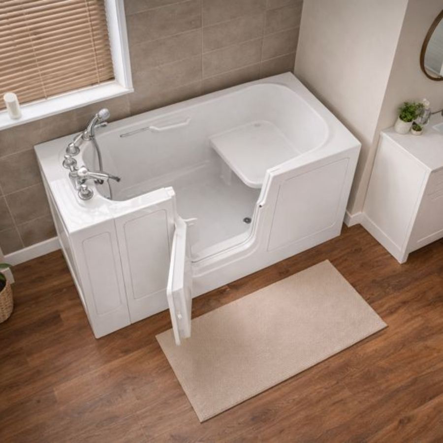 Summerville SC walk-in tub in a modern bathroom with open side-entry door, built-in seat, chrome fixtures, beige tile wall and wood-look flooring for safe senior accessible soaking and bathing.